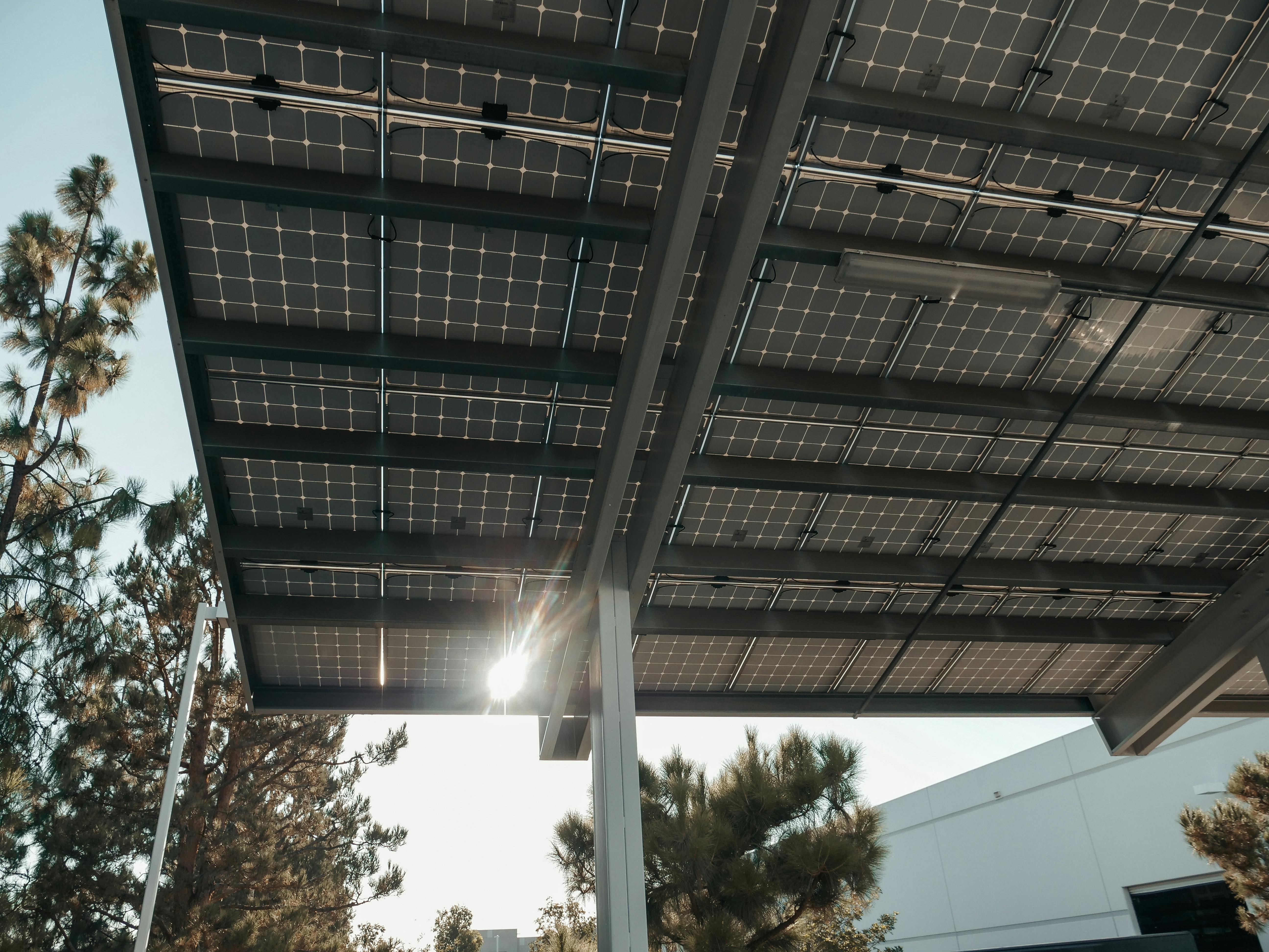 Dramatic carport pergola structure with solar panels mounted on top - showing how balcony and plug-in solar systems can be installed on garden structures as well as balconies